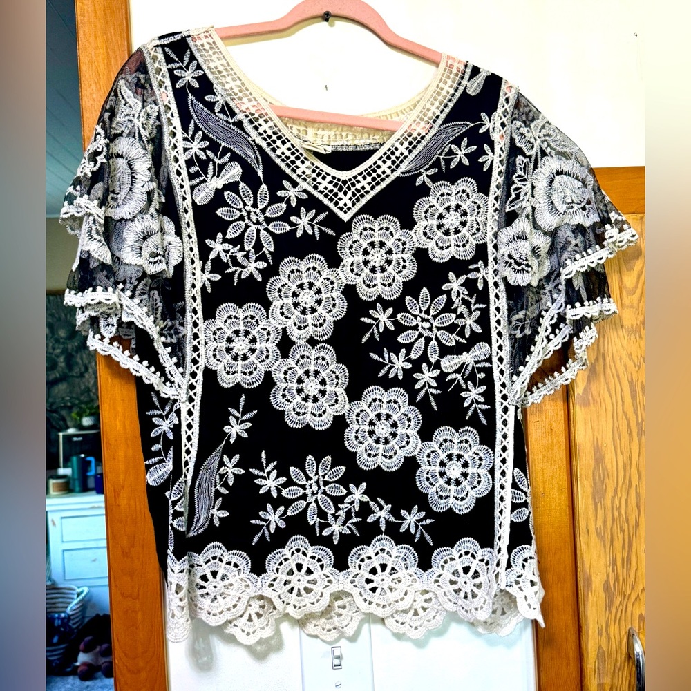 Women’s large lace/crochet blouse.